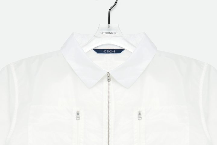 A promotional image of a Nothing Apparel shirt.