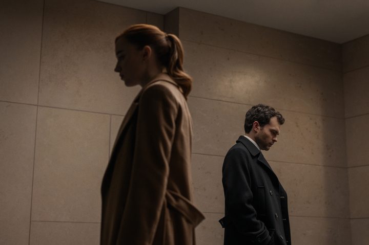 Phoebe Dynevor and Alden Ehrenreich face away from each other in Fair Play.