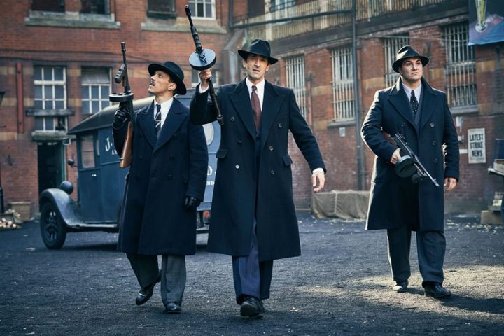 Adrien Brody holding a gun in Peaky Blinders.