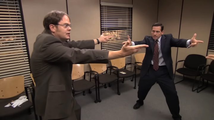 Dwight and Michael pointing imaginary guns at each other in "The Office."