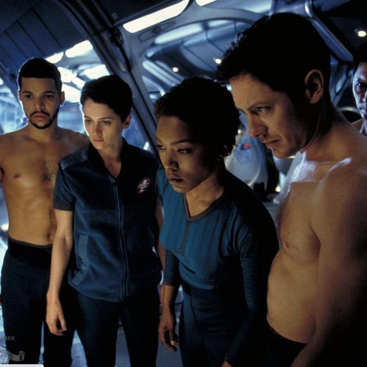 A group of astronauts stand together in Supernova.