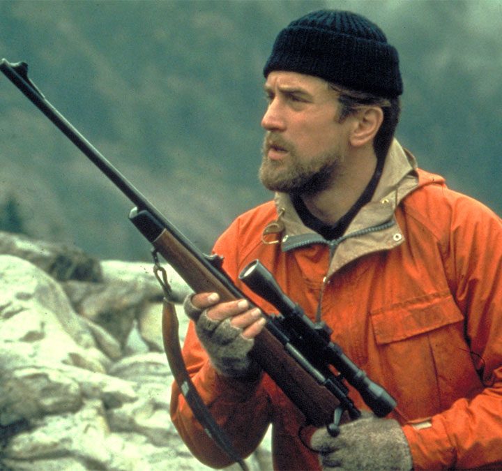 Robert De Niro holding a hunting rifle in "The Deer Hunter."