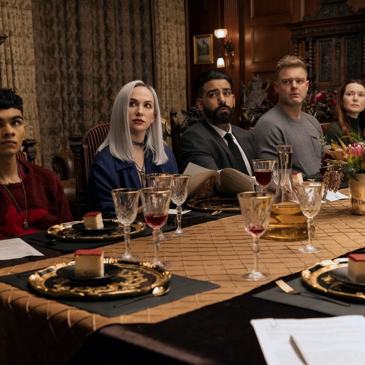 The Usher children sit at a dinner table together in The Fall of the House of Usher.