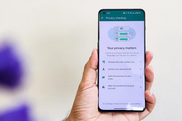 WhatsApp Priavcy policy screen on Android phone held in hand.