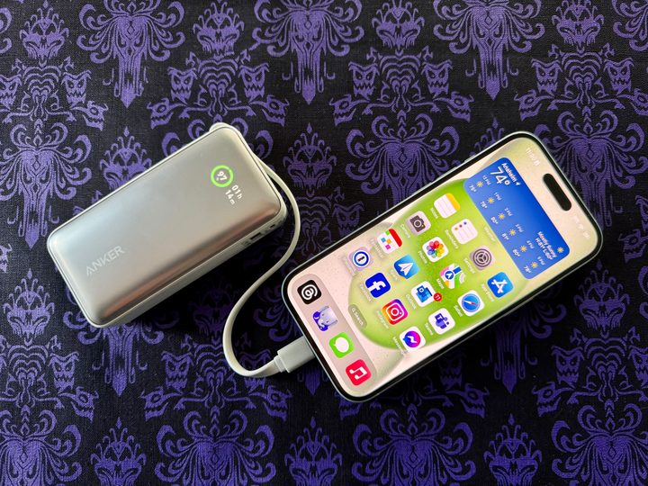 Anker Nano 30W Power Bank with USB-C in green charging up an iPhone 15.