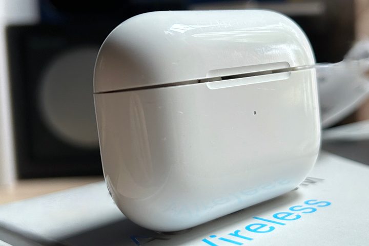 Apple AirPods Pro 2 charging case with lid partially open.