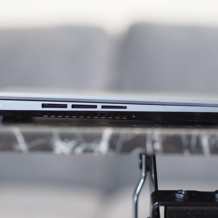 Asus Zenbook 14X OLED left side view showing port and vents.