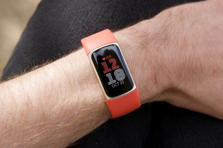 Someone wearing a Fitbit Charge 6.