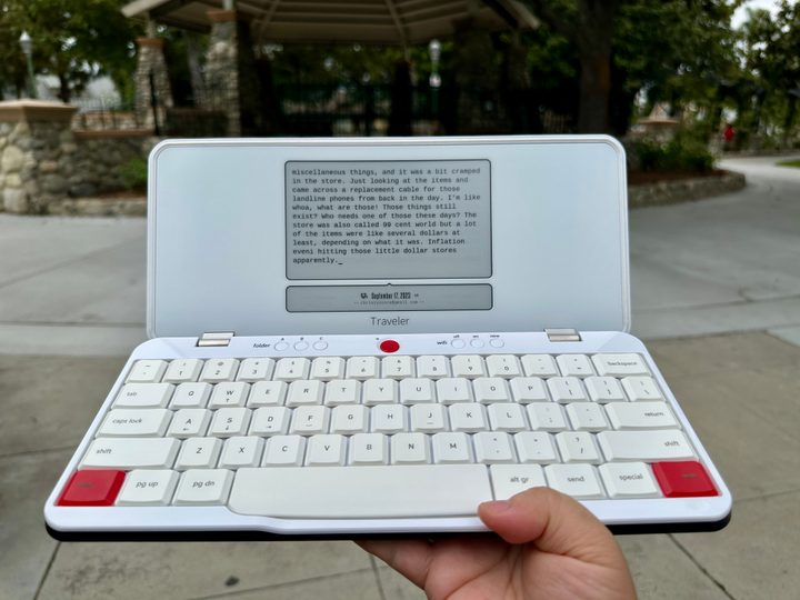 Freewrite Traveler open in hand.