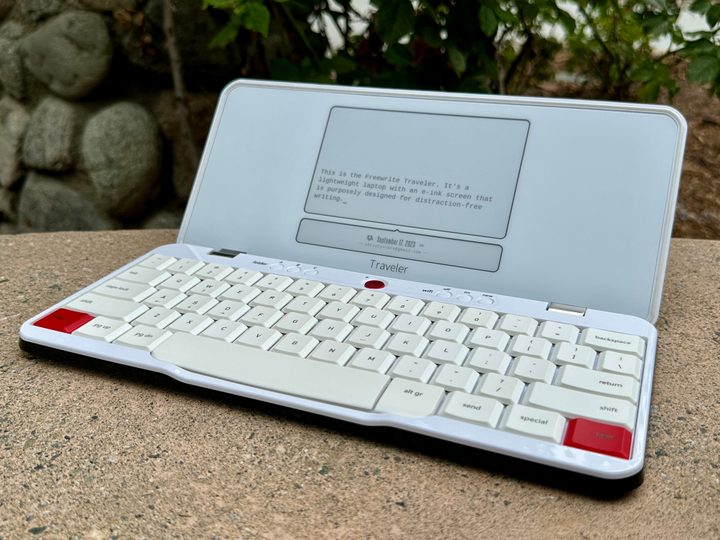 Freewrite Traveler open on a bench angled slightly.