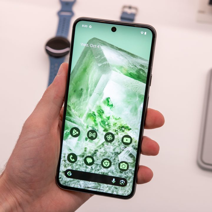 Google Pixel 8 Pro held with its screen on.