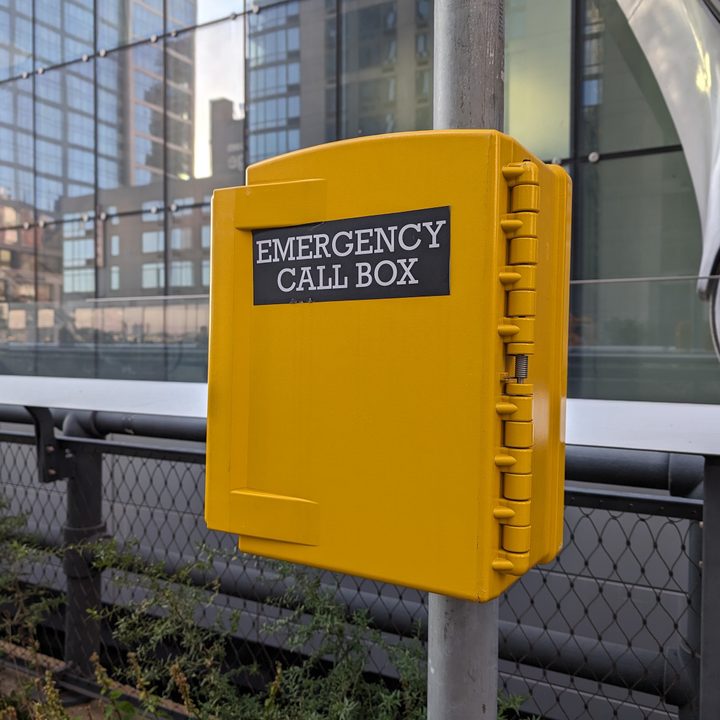 Photo of a yellow emergency call box, taken with the Google Pixel 8 Pro.