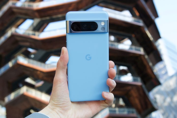 Someone holding the Bay blue Google Pixel 8 Pro.