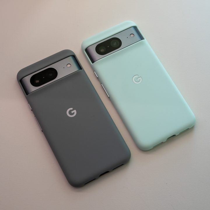Google Pixel 8 in two different case colors.