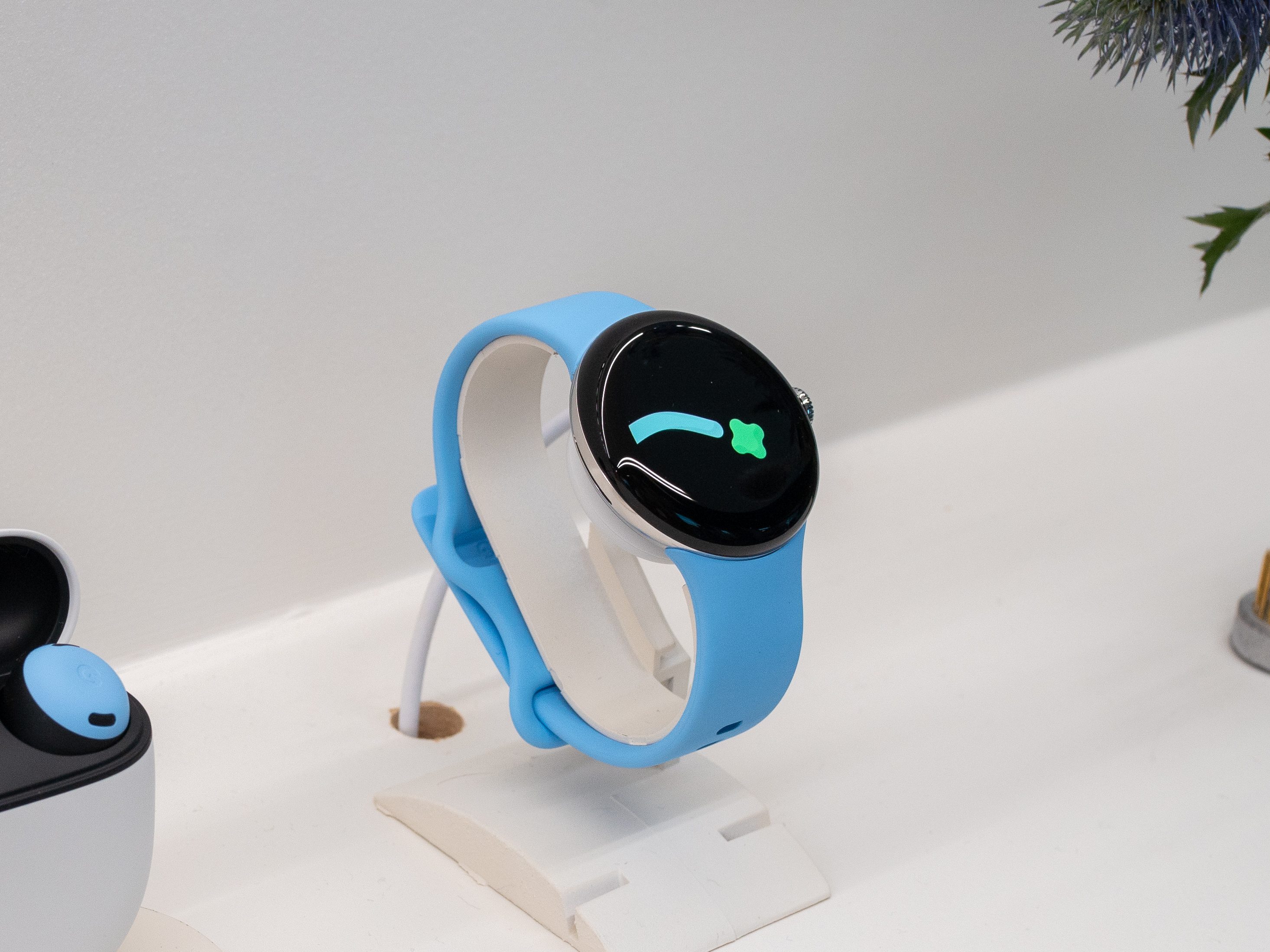 Google Pixel Watch 2 smartwatch with a blue sport band.