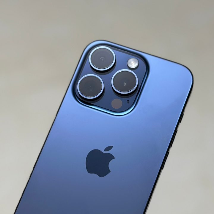 The back of a blue iPhone 15 Pro.