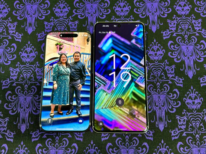 An iPhone 15 Pro in Blue Titanium (left) and Google Pixel 8 Pro in Porcelain showing lock screens.