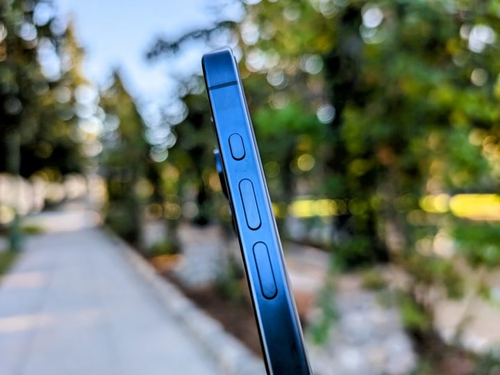 Blue Titanium iPhone 15 Pro Action button.