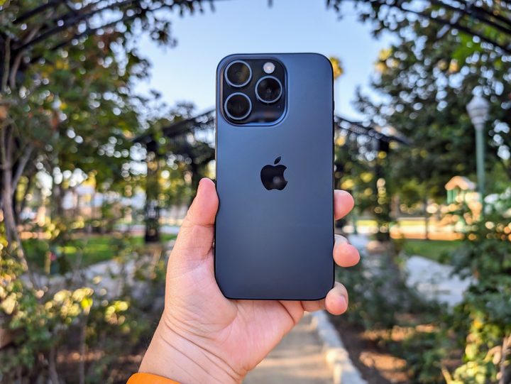 Blue Titanium iPhone 15 Pro in hand.