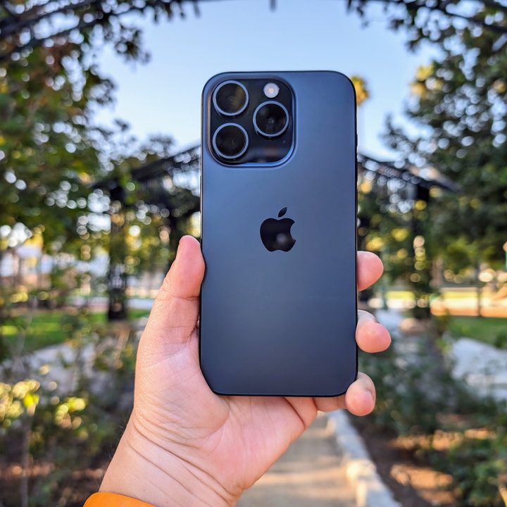 Blue Titanium iPhone 15 Pro in hand.