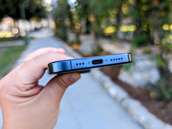 Blue Titanium iPhone 15 Pro showing USB-C port.