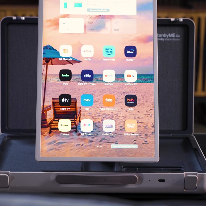 A LG StanbyMe Go monitor in vertical orientation displaying apps.
