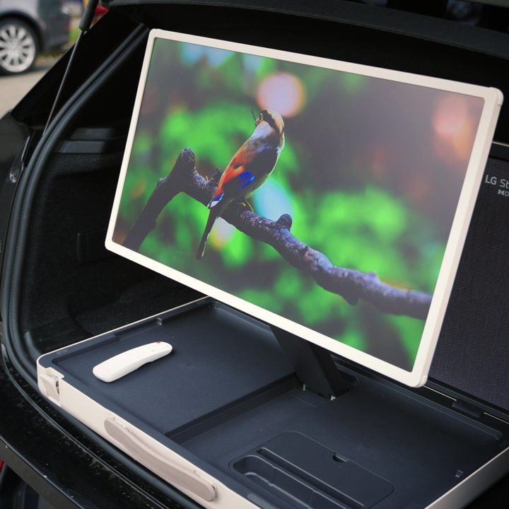 A LG StanbyMe Go set up in the trunk of a car.
