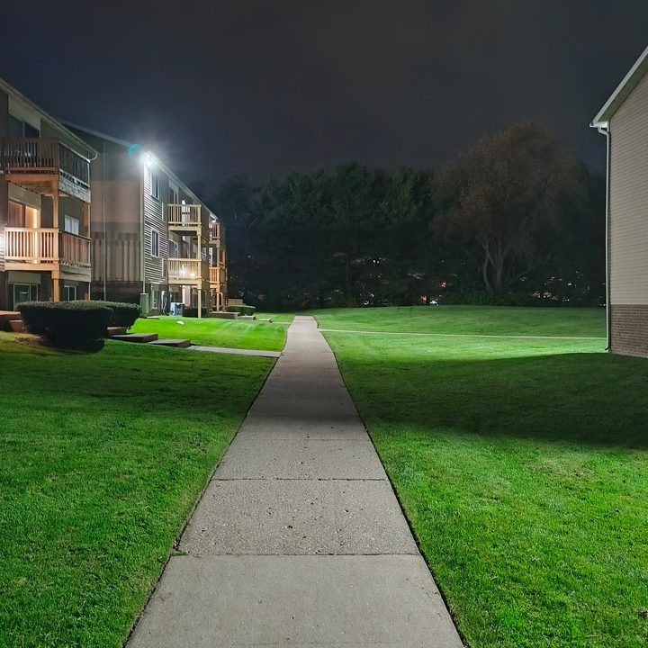 Photo of a sidewalk in an apartment complex at night, taken with the Motorola Edge (2023).