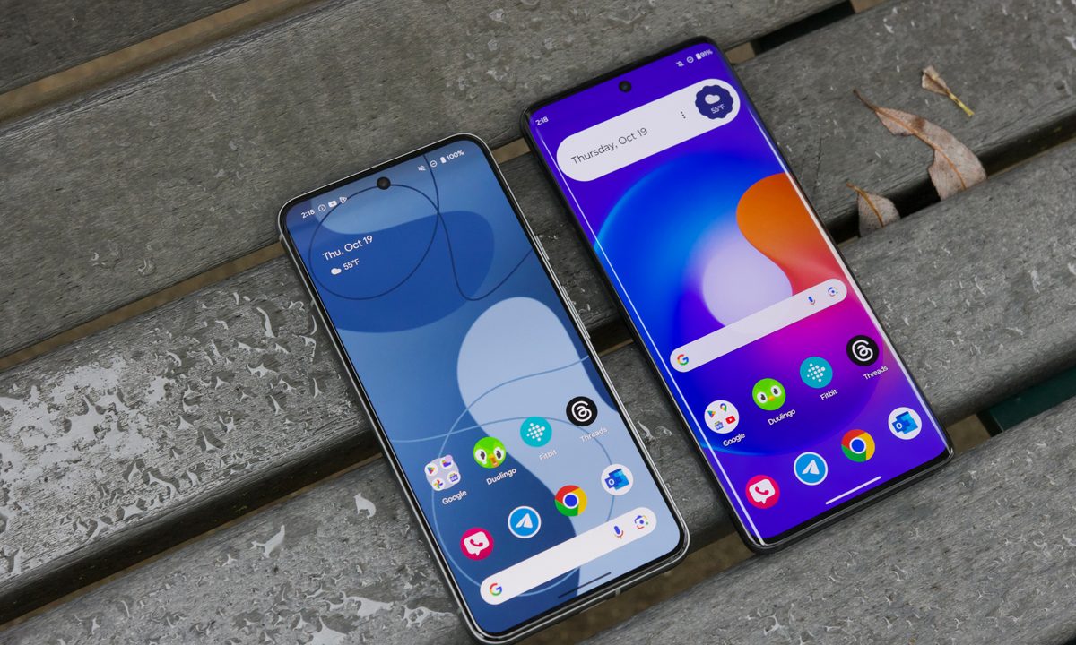 The Google Pixel 8 and Motorola Edge (2023) laying on a bench with their screens turned on.