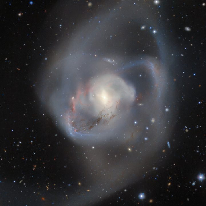 Gemini South, one half of the International Gemini Observatory operated by NSF’s NOIRLab, captures the billion-year-old aftermath of a double spiral galaxy collision. At the heart of this chaotic interaction, entwined and caught in the midst of the chaos, is a pair of supermassive black holes — the closest such pair ever recorded from Earth.