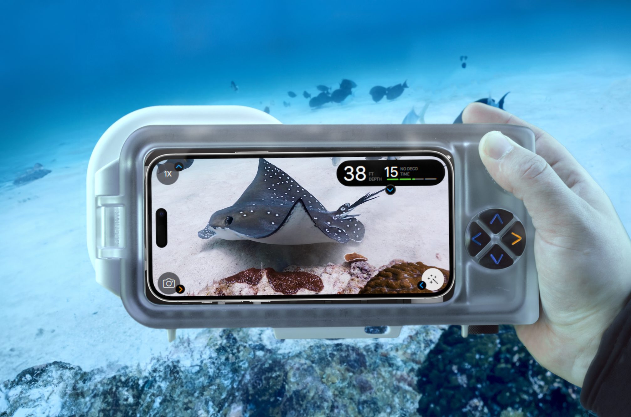 A person using the Oceanic+ Dive Housing.