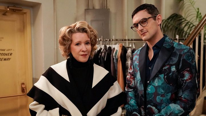 Donna and Cliff standing next to one another smiling in a scene from Only Murders in the Building season 3.