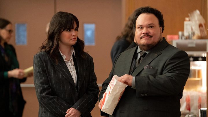 Mabel standing beside Gregg in a scene from Only Murders in the Building season 3.