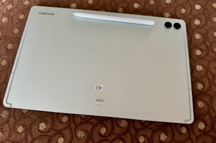 The back of a mint colored Samsung Galaxy Tab S9 FE+.