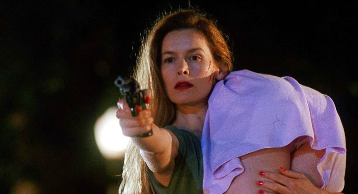 A woman aims a gun in Sleepwalkers.