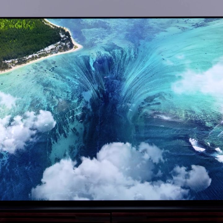 An aerial view of the underwater waterfall near Mauritius shows on a Sony A95K OLED.