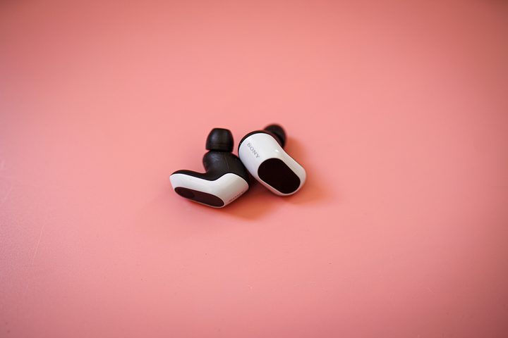 The Sony InZone Buds sitting outside the case.