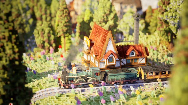 A train moves through the countryside in Station to Station.