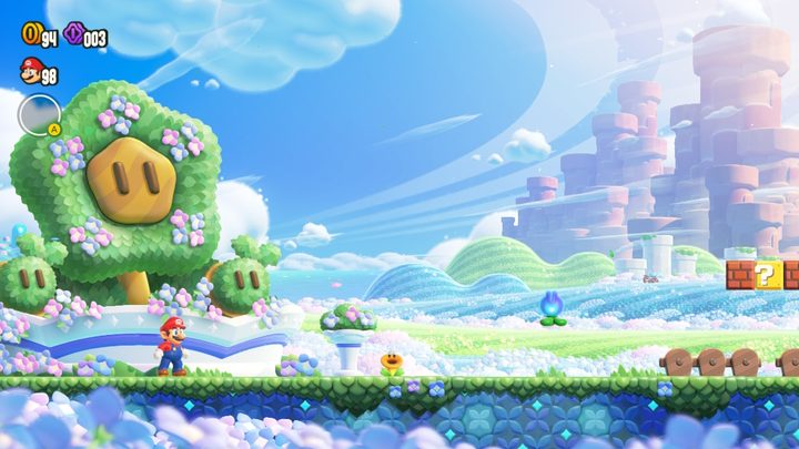 Mario stands in the Flower Kingdom in Super Mario Bros. Wonder.