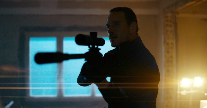 A man aims a gun in The Killer.
