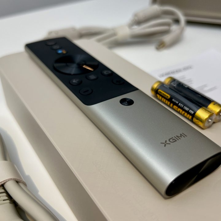 The Android remote and other items in the box of the The Xgimi Horizon Ultra projector.