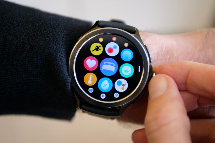 A person twisting the crown on the Xiaomi Watch 2 Pro.