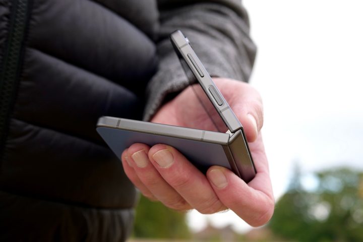 A person folding up the Samsung Galaxy Z Flip 5.