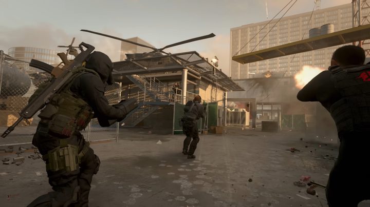 Soldiers fighting near a helipad.