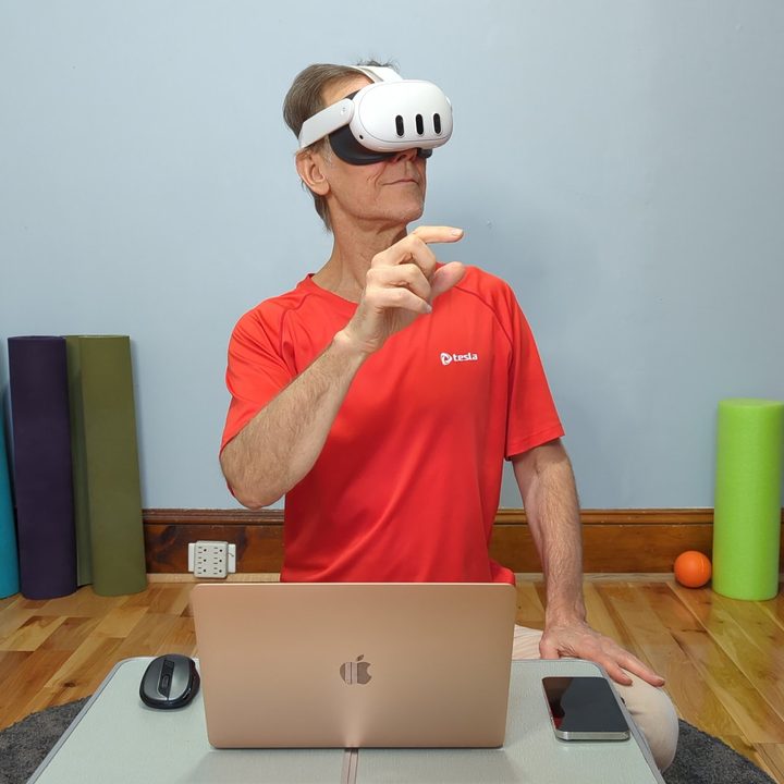 Alan Truly using a Quest 3 with a MacBook Air for work.