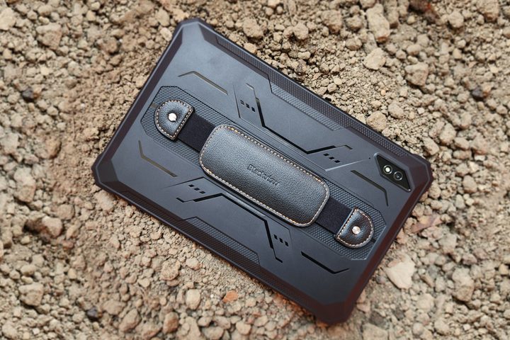 Blackview Active 8 Pro rugged Android tablet in black color on a pile of earth.