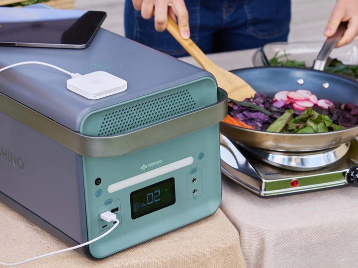 Camper using Yoshino BT4000 SST power station to cook