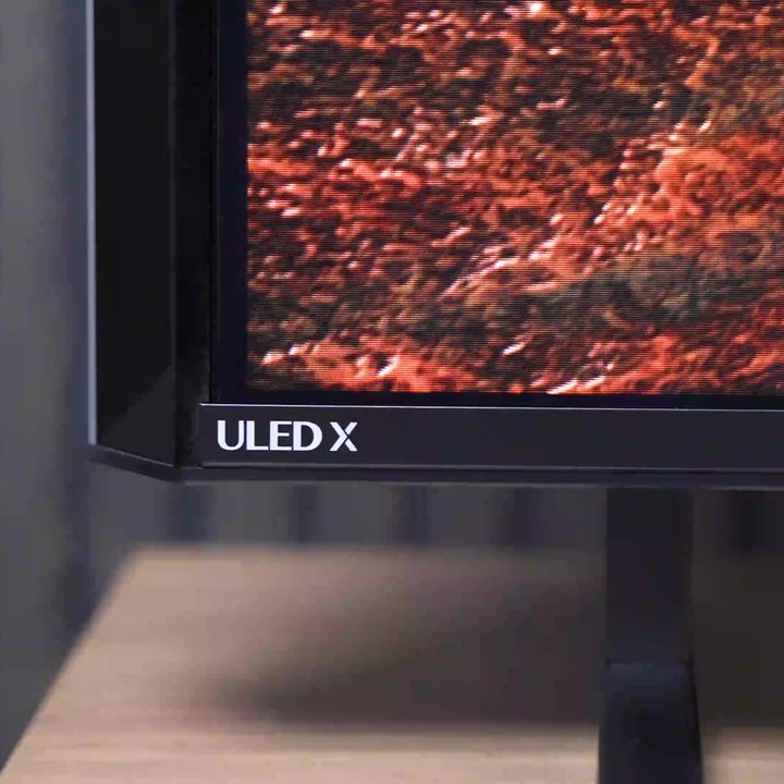 The side and bottom bezel of a Hisense UX TV showing the side speaker.