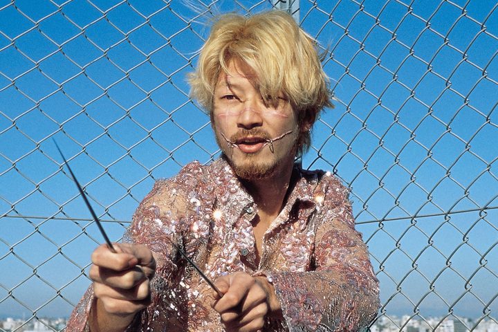 Kakihara holding sharp chopsticks in Ichi the Killer.