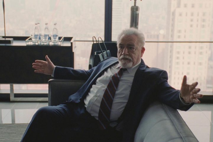 Logan Roy sitting on a couch in his office in The Disruption in Succession